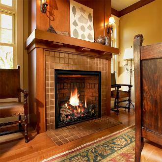 large indoor fireplace with firelogs